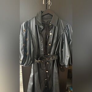 Elegant Black Leather Jacket with Gold Accents